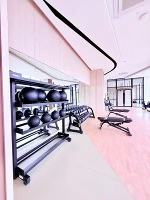 a fitness room with a row of exercise bikes at Luxury Home At Axon Residence Bukit Bintang KLCC Pavilion in Kuala Lumpur