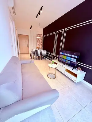 a living room with a couch and a flat screen tv at Luxury Home At Axon Residence Bukit Bintang KLCC Pavilion in Kuala Lumpur
