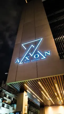 a sign on the side of a building at Axon in Kuala Lumpur