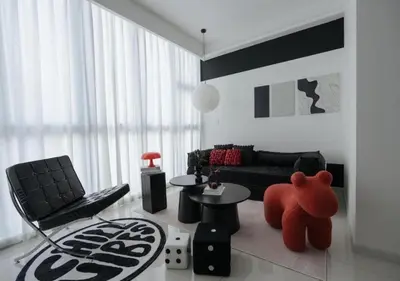 a living room with a red teddy bear in the middle at Cool Cityscape Homestay in KL City Center 1-5pax in Kuala Lumpur