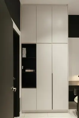 a white cabinet in a room with at Cool Cityscape Homestay in KL City Center 1-5pax in Kuala Lumpur