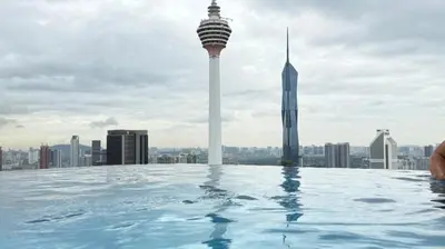 a infinity pool on the roof of a building at The Platinum KLCC By Pool Point in Kuala Lumpur
