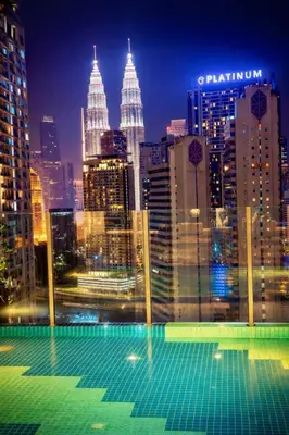 a view of a city skyline at night at Majestic Residence klcc by Stay Suites in Kuala Lumpur