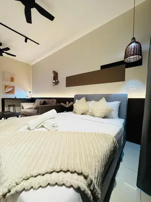 a bedroom with a large bed in a room at Majestic Residence klcc by Stay Suites in Kuala Lumpur