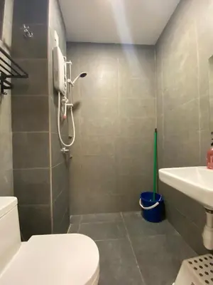 a bathroom with a toilet and a sink at Neu Suites KLCC by HMM Home in Kuala Lumpur