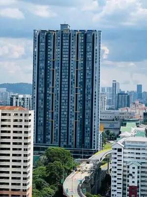 a large tall building in a city with buildings at Neu Suites Apartment - Cozy Modern Stay near KLCC in Kuala Lumpur