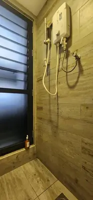 a room with a hair dryer on a wooden wall at Arte Mont Kiara By Whitedoorz in Kuala Lumpur