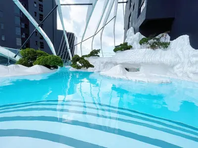 a large pool of water with an ice sculpture at Arte Mont Kiara By Whitedoorz in Kuala Lumpur