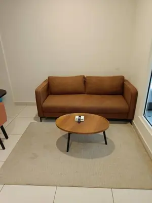 a living room with a couch and a coffee table at Arte Mont Kiara By Whitedoorz in Kuala Lumpur