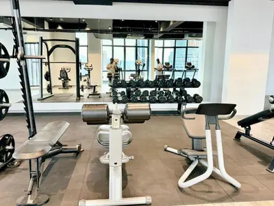 a gym with several exercise equipment in a room at The Manor Kuala Lampur in Kuala Lumpur