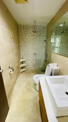 a bathroom with a white toilet and a sink at Regalia SkyLux Studio in Kuala Lumpur