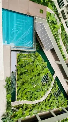 an overhead view of a building with a swimming pool at Regalia SkyLux Studio in Kuala Lumpur