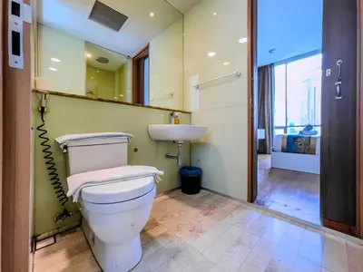 a bathroom with a toilet and a sink at VORTEX SUITES KLCC By HOMESTAY in Kuala Lumpur