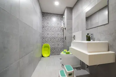 a bathroom with a white sink and a toilet at 9pax, Slide, RockClimbing, Arcade, near City & MITEC in Kuala Lumpur