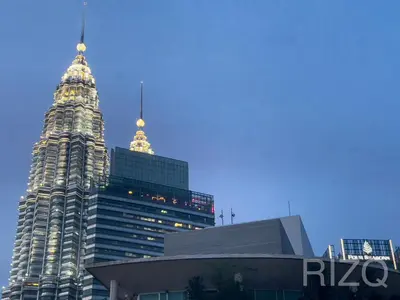 a group of tall skyscrapers in a city at SOHO SUITES KLCC BY Homestay in Kuala Lumpur