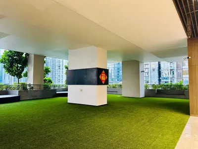 a room with green grass and columns in a building at KLCC City View luxury Suites in Kuala Lumpur