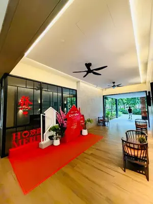 a living room with a red rug and a ceiling at Agile Bukit Bintang TRX By Empire Suites in Kuala Lumpur