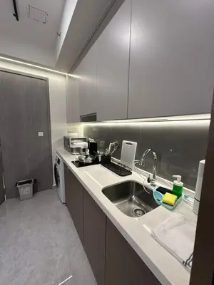 a kitchen with a sink and a counter top at Sky Line Suites KL Podu in Kuala Lumpur