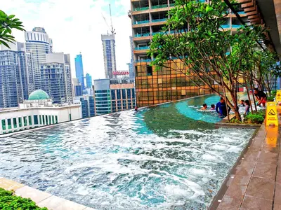 a swimming pool on the roof of a building at Kuala Lumpur Services Apartments In A X O N Residence in Kuala Lumpur