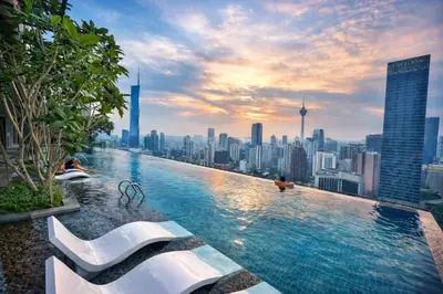 a infinity pool with a view of a city at Kuala Lumpur Services Apartments In A X O N Residence in Kuala Lumpur