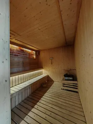 an empty wooden sauna with wooden floors and ceilings at Kuala Lumpur Services Apartments In A X O N Residence in Kuala Lumpur