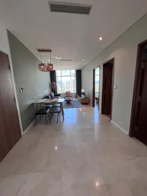 a large living room with a table and chairs at Sky suites klcc Family suites home in Kuala Lumpur