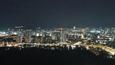 a view of a city at night with lights at Family Suites at TRION KL in Kuala Lumpur