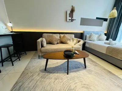 a living room with a couch and a coffee table at Majestic Residence at KLCC By Fortune in Kuala Lumpur