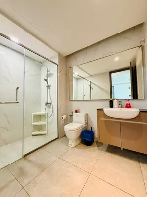 a bathroom with a toilet and a sink and a shower at Agile Bukit Bintang TRX By RUP Suites in Kuala Lumpur
