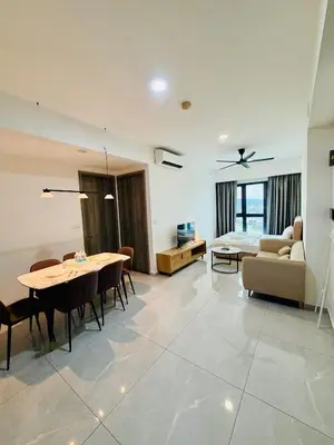a living room with a table and a couch at Agile Bukit Bintang TRX By RUP Suites in Kuala Lumpur