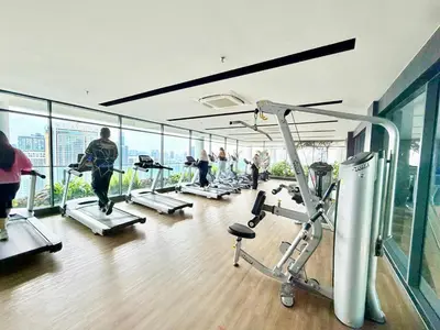 a gym with people exercising on treadmills in a building at The luxe by Kuala Lampur City in Kuala Lumpur