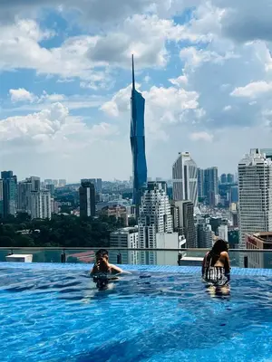 a infinity pool with a view of the city at Sky property by klcc in Kuala Lumpur