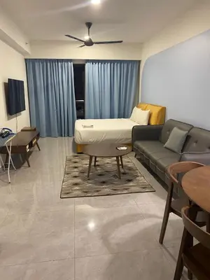 a living room with a couch and a table at agile residence in Kuala Lumpur