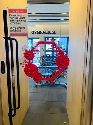 a window with red flowers hanging from a door at agile residence in Kuala Lumpur