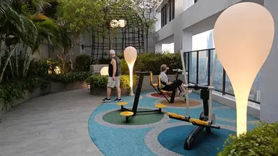 a man and a woman playing in a gym at Sky Residence at TRION KL in Kuala Lumpur