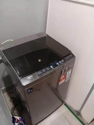 a machine sitting in a corner of a refrigerator at Sky Residence at TRION KL in Kuala Lumpur
