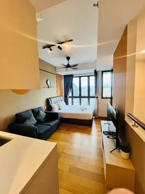 a living room with a couch and a bed at Sky property infinitum 2 in Kuala Lumpur