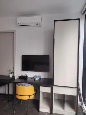 an office with a desk and a yellow chair at Scarletz Suites KLCC by near twin tower in Kuala Lumpur