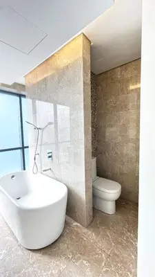 a bathroom with a white sink and a toilet at 3BR family friendly Apartment at The Elements Ampang Kuala Lumpur in Kuala Lumpur