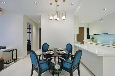 a dining room with a table and blue chairs at Met 1 Mont Kiara - 3 min to Publika Mall - 2B2B for 4 in Kuala Lumpur