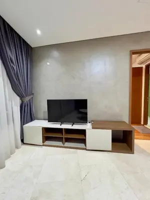 a living room with a flat screen tv on a wall at Vortex in Kuala Lumpur