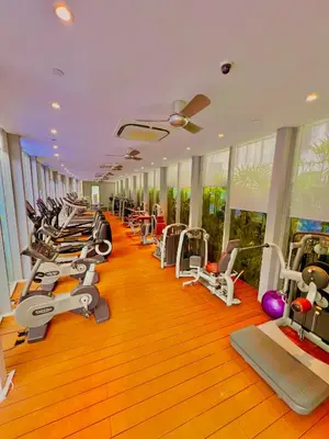 a gym with a row of treadms and machines at Vortex in Kuala Lumpur