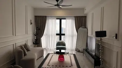 a living room with a couch and a chair at Agile Residence Sky View Suites in Kuala Lumpur