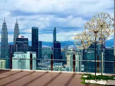 a view of a city skyline with a ferris wheel at Agile Residence Sky View Suites in Kuala Lumpur