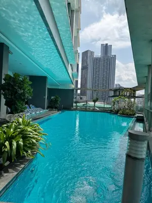 a large swimming pool on the roof of a building at Bukit Bintang Casa By Eryan Guest House in Kuala Lumpur