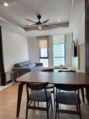 a living room with a table and chairs and a couch at Bukit Bintang Casa By Eryan Guest House in Kuala Lumpur