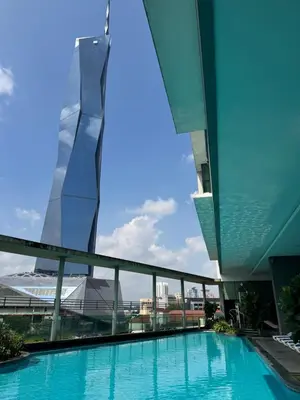 a view of a building with a swimming pool at Bukit Bintang Casa By Eryan Guest House in Kuala Lumpur