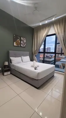 a bedroom with a large bed and a large window at Trion Kuala Lumpur in Kuala Lumpur