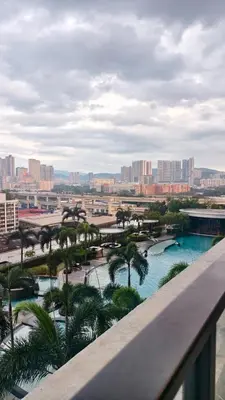a view of a resort with a pool and palm trees at Trion Kuala Lumpur in Kuala Lumpur