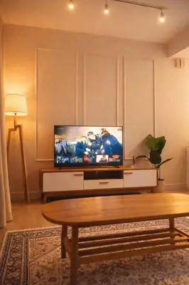a living room with a tv and a coffee table at Trion Kuala Lumpur in Kuala Lumpur